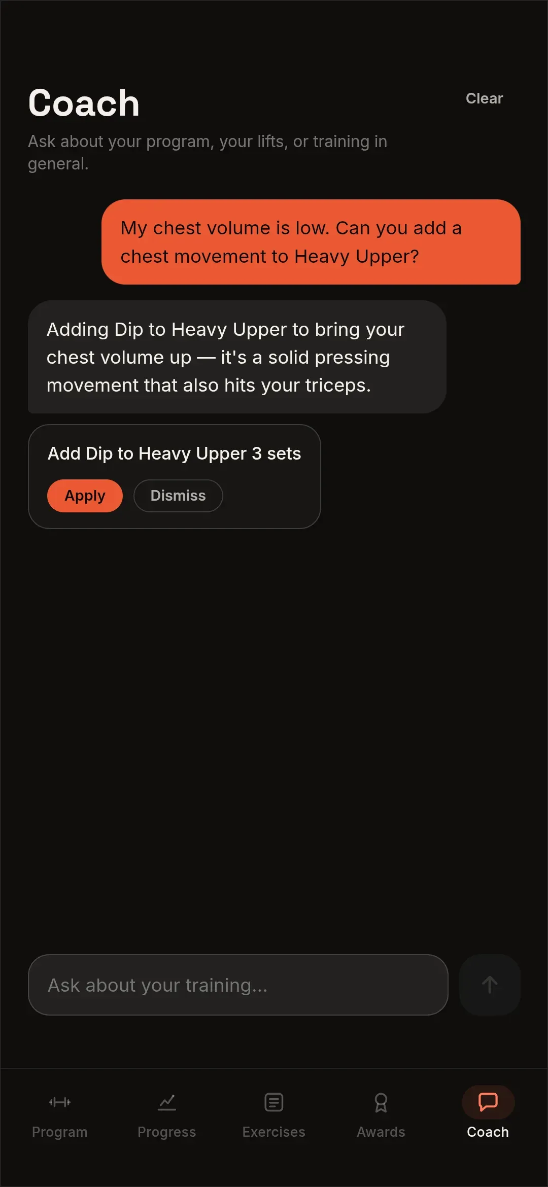 The Alpha Lifts coach answering a request to add a chest movement, proposing a Dip as a change with Apply and Dismiss buttons.